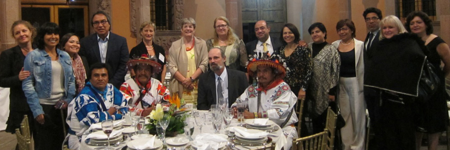 Group photo of conference attendees at dinner